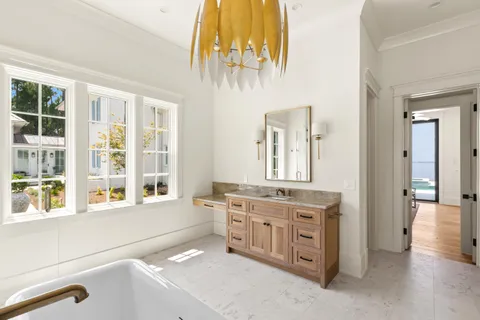 a view of a stone house with large windows