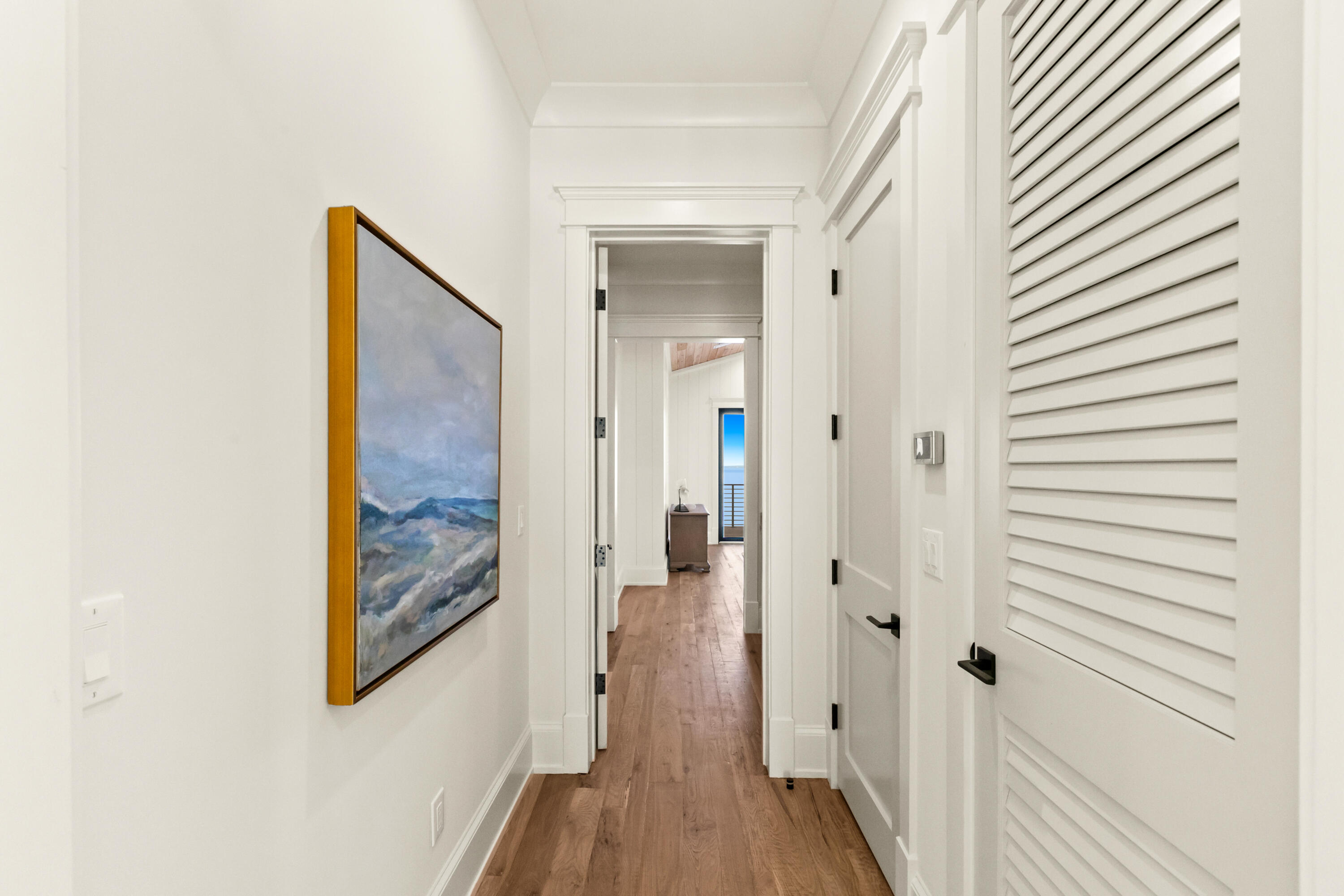 22 Carolyn Lane Santa Rosa Beach, FL 32459 - Photo 57 of 108 a view of a hallway with wooden floor and a bathroom