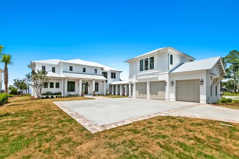 a view of an house with swimming pool in front of main door