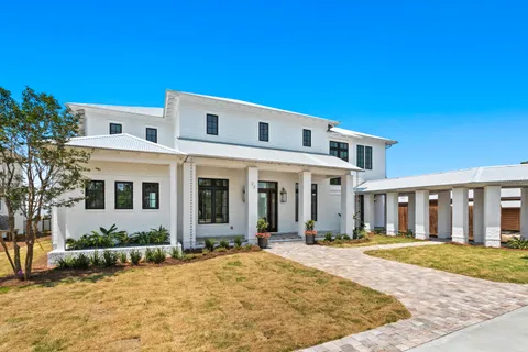 a view of a swimming pool with an outdoor seating