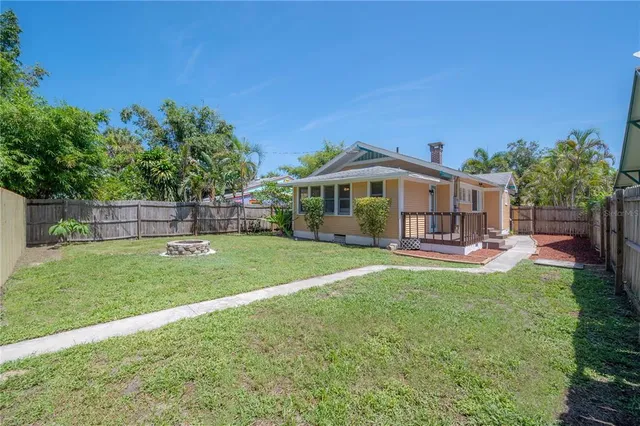 a view of a house with a yard porch and sitting area