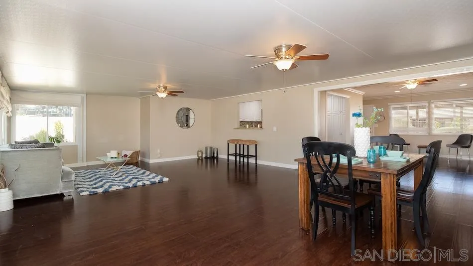 9265 Ruffin Road Santee, CA 92071 - Photo 12 of 25 a view of a dining room with furniture and wooden floor