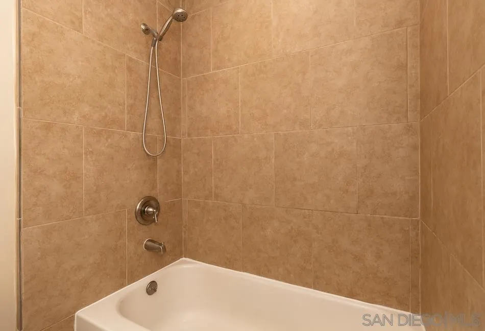 9265 Ruffin Road Santee, CA 92071 - Photo 15 of 25 a bathroom with a bathtub