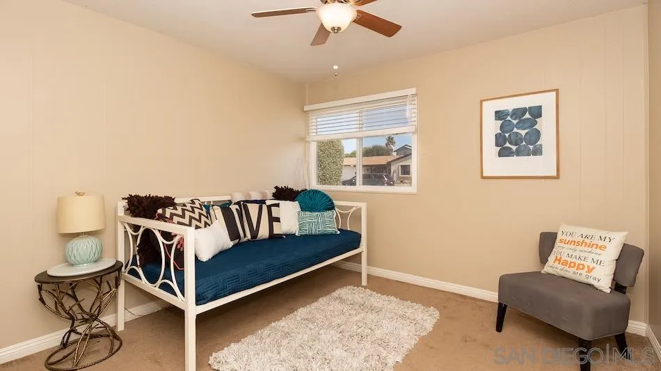 9265 Ruffin Road Santee, CA 92071 - Photo 17 of 25 a living room with furniture and a rug