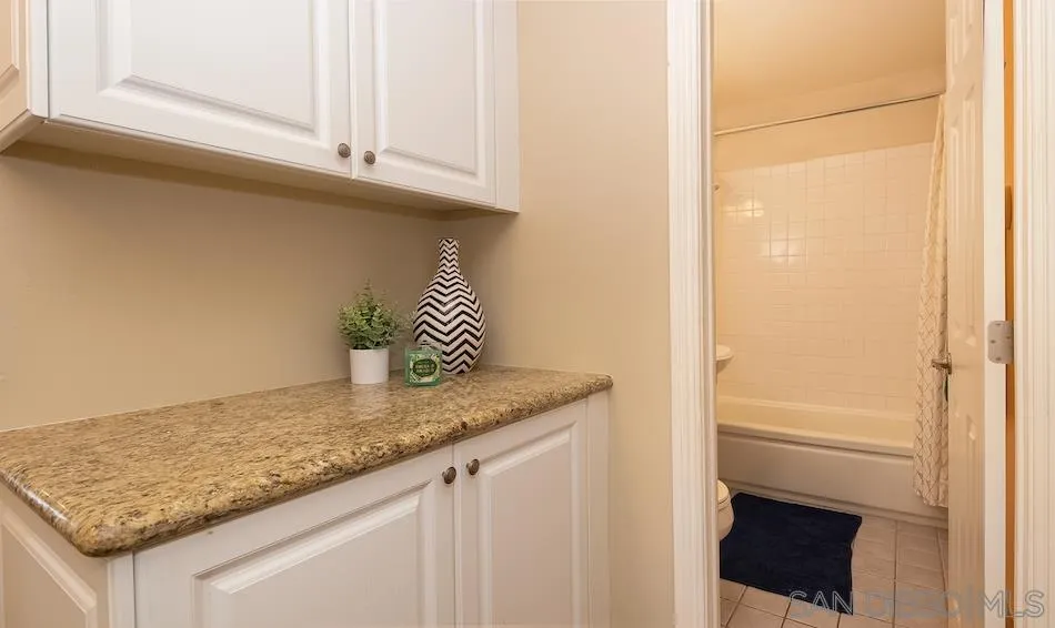 9265 Ruffin Road Santee, CA 92071 - Photo 19 of 25 a kitchen with a sink and a refrigerator