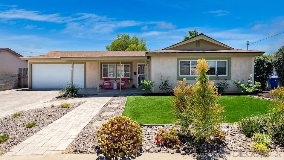 9265 Ruffin Road Santee, CA 92071 - Photo 2 of 25 a front view of a house with a yard