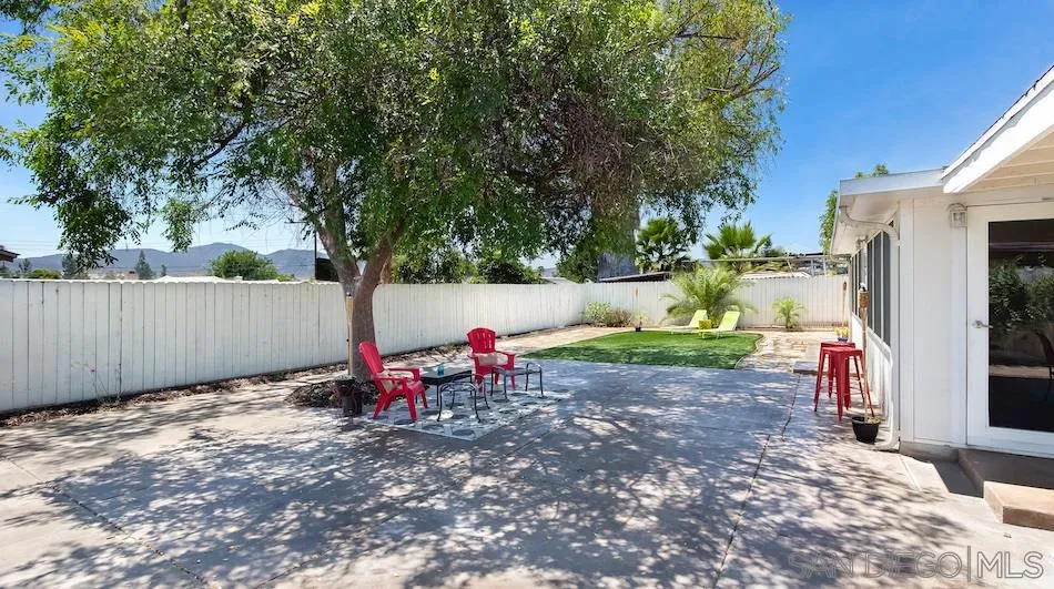 9265 Ruffin Road Santee, CA 92071 - Photo 23 of 25 a view of a backyard with a table and chairs