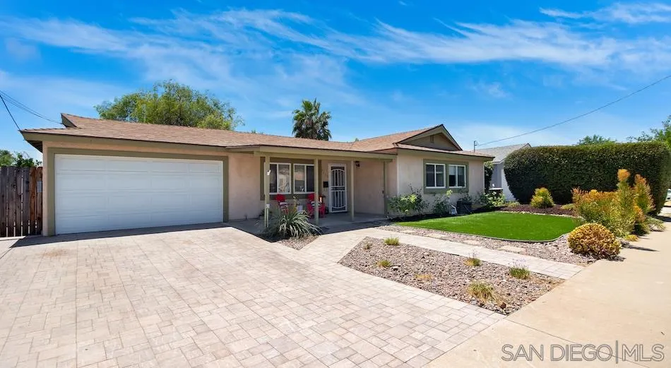 9265 Ruffin Road Santee, CA 92071 - Photo 3 of 25 a front view of a house with a yard and garage