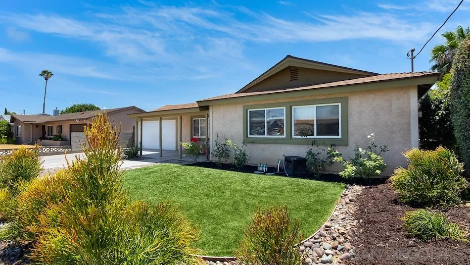 9265 Ruffin Road Santee, CA 92071 - Photo 4 of 25 a front view of a house with garden