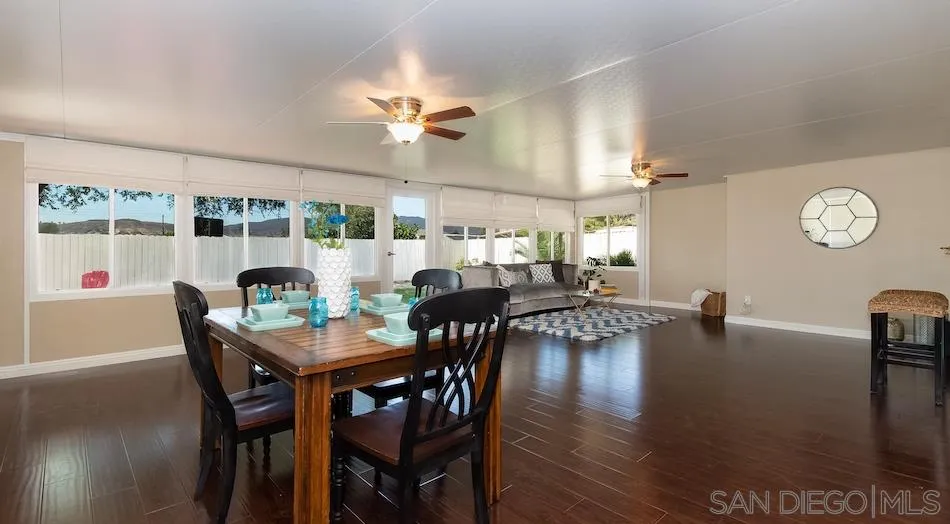 9265 Ruffin Road Santee, CA 92071 - Photo 10 of 25 a view of a dining room with furniture window and wooden floor