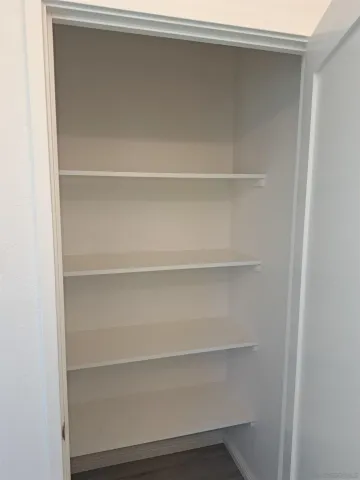 a view of an empty walk in closet