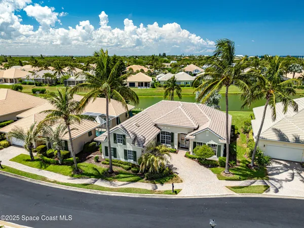 a view of a house with a yard and garden