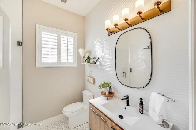an aerial view of a house with a ocean view