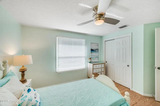 a view of a swimming pool with a patio and a yard