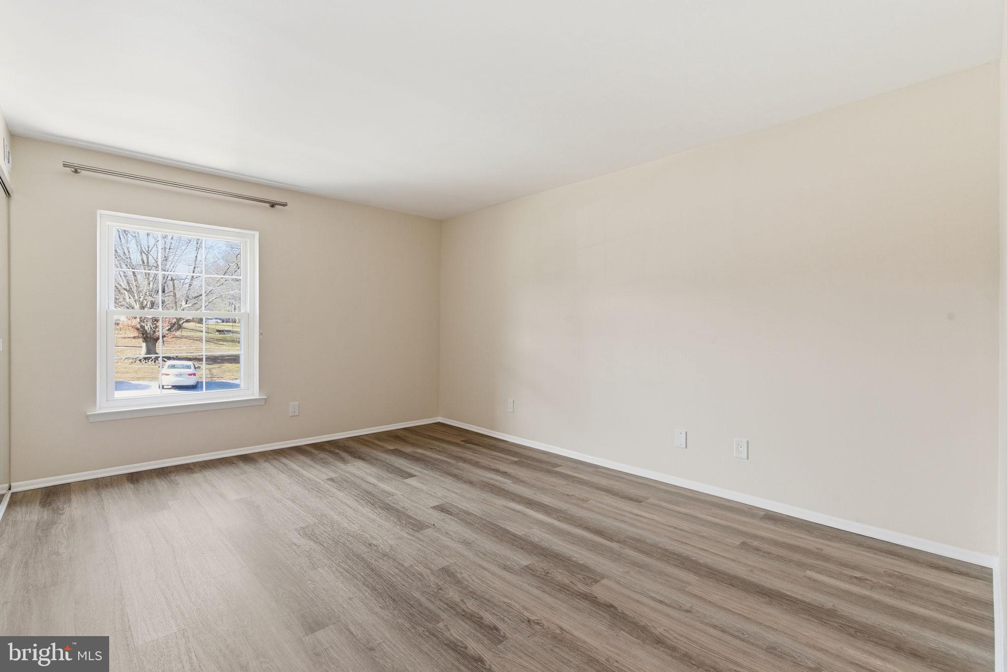 463 Old Forge Crossing Devon, PA 19333 - Photo 14 of 21 an empty room with wooden floor and windows