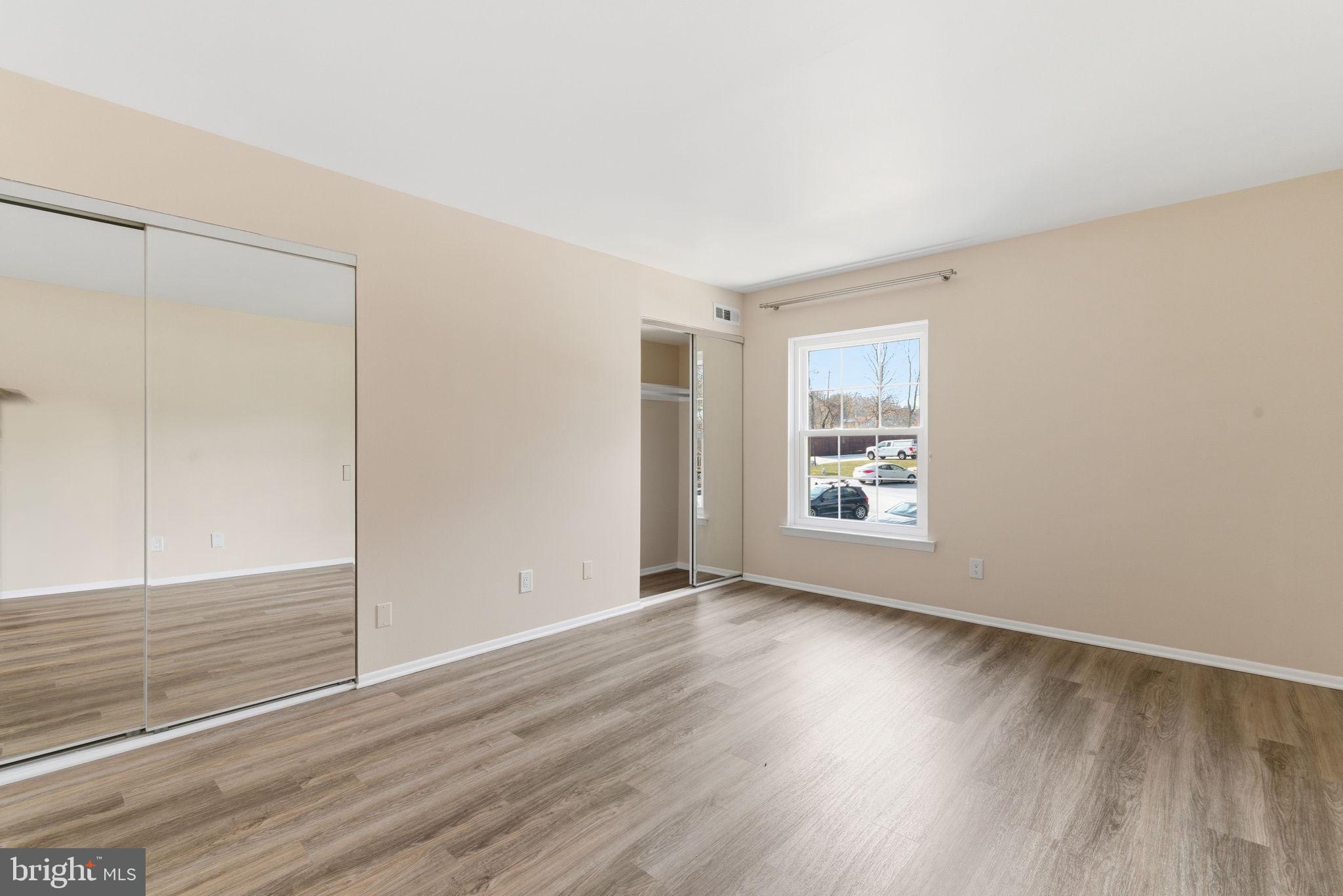 463 Old Forge Crossing Devon, PA 19333 - Photo 15 of 21 a view of an empty room with wooden floor and a window