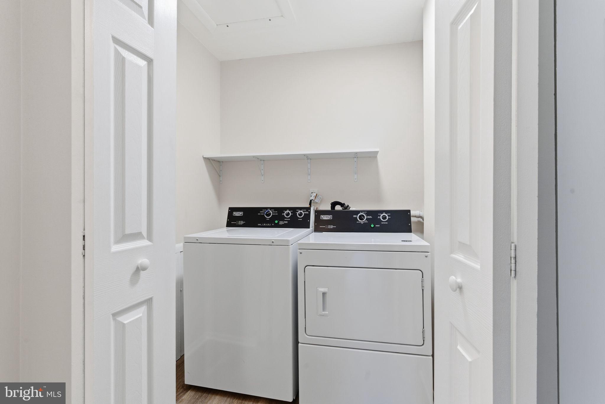 463 Old Forge Crossing Devon, PA 19333 - Photo 16 of 21 a view of washer and dryer with kitchen in the background