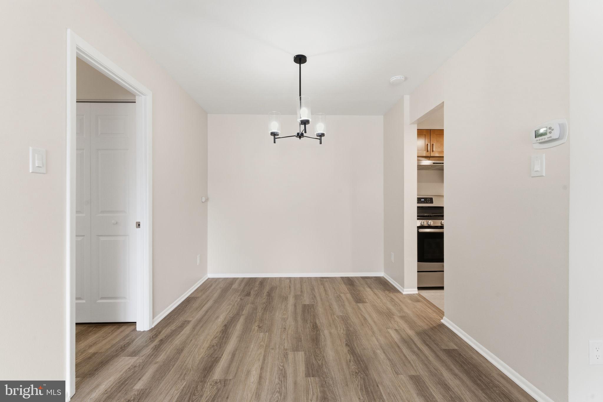 463 Old Forge Crossing Devon, PA 19333 - Photo 7 of 21 a view of a room with wooden floor closet and entryway