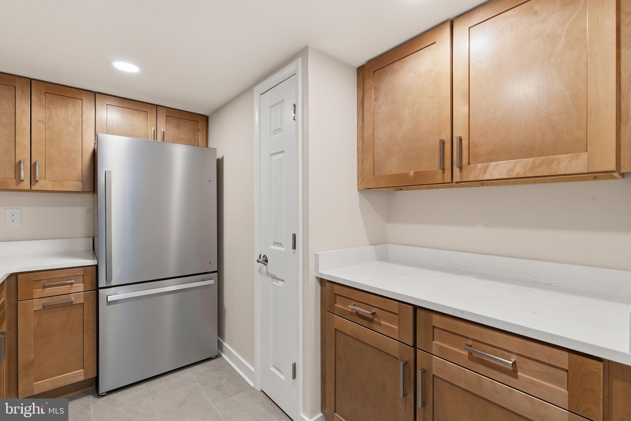 463 Old Forge Crossing Devon, PA 19333 - Photo 9 of 21 a kitchen with a refrigerator and cabinets
