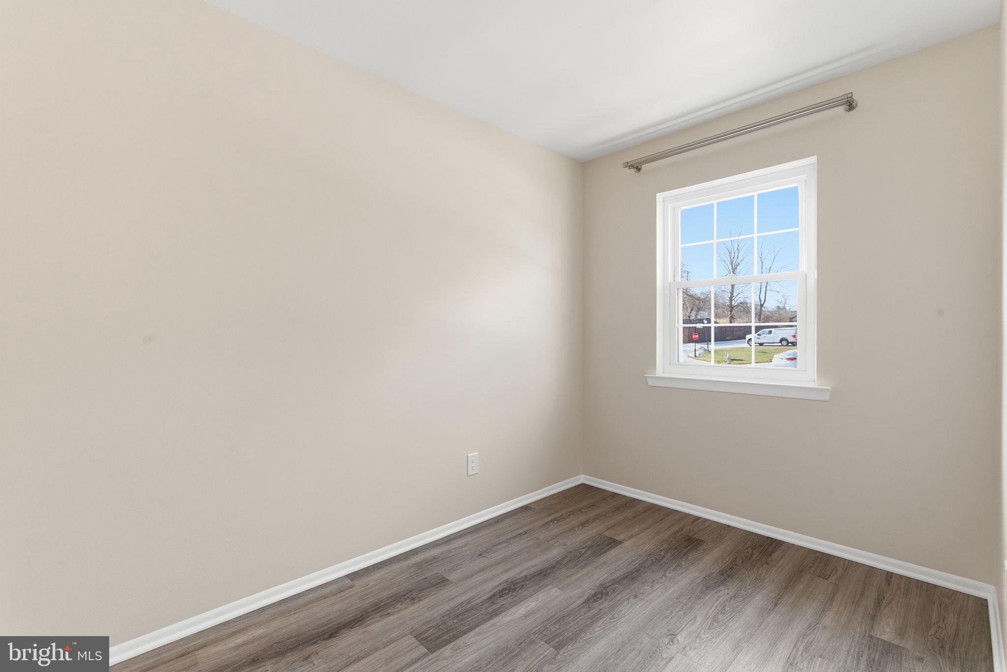 463 Old Forge Crossing Devon, PA 19333 - Photo 10 of 21 a view of an empty room with wooden floor and a window