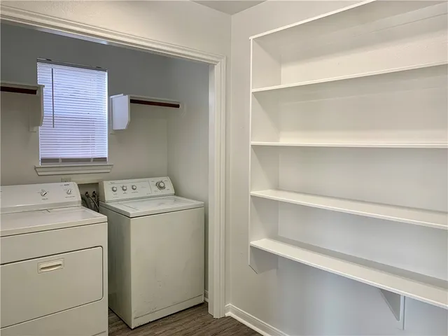 a view of storage and utility room with washer and dryer