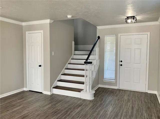 a view of entryway with wooden floor