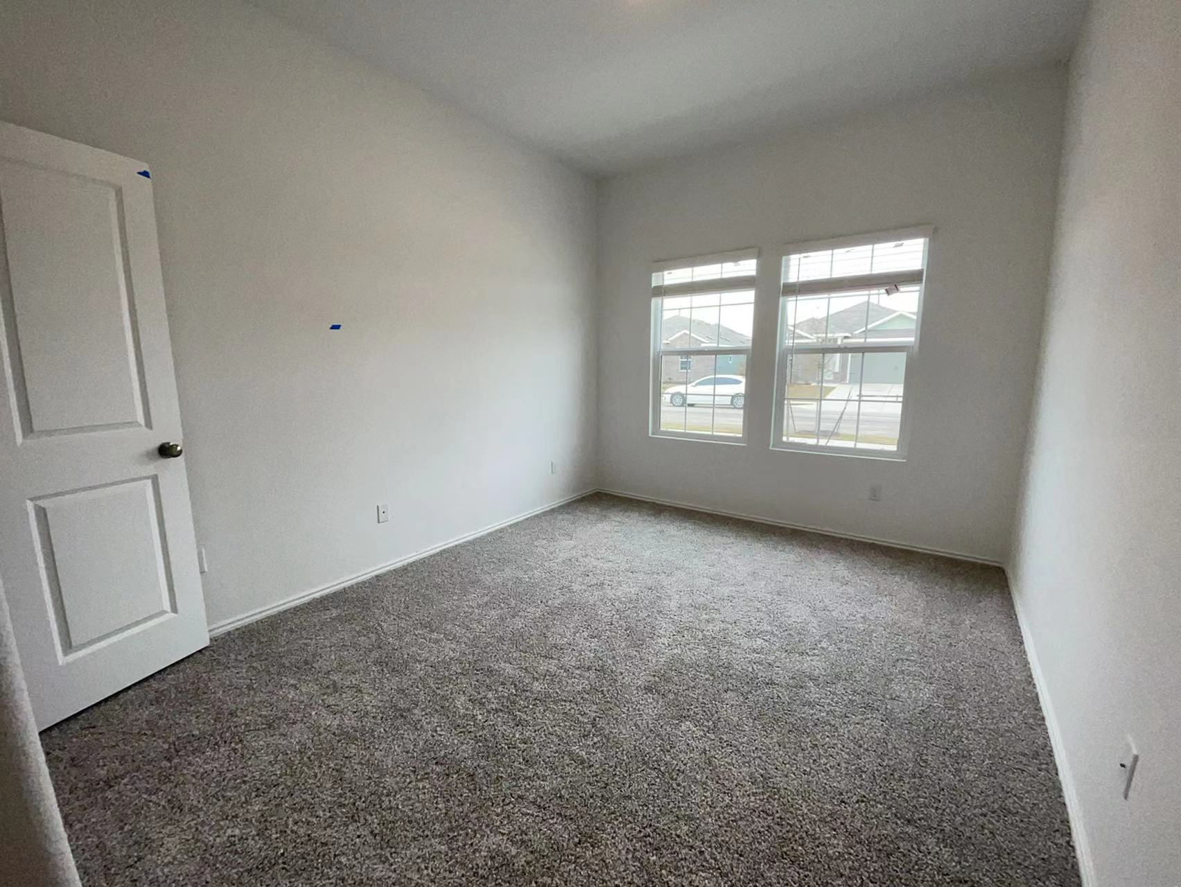 125 Madrid Kyle, TX 78640 - Photo 13 of 23 Unfurnished room with carpet floors and baseboards