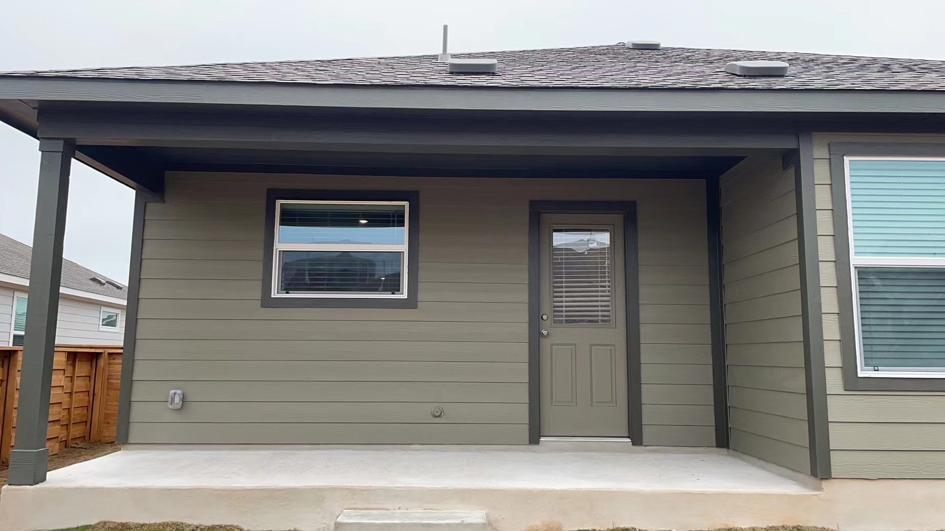 125 Madrid Kyle, TX 78640 - Photo 18 of 23 Property entrance featuring a shingled roof