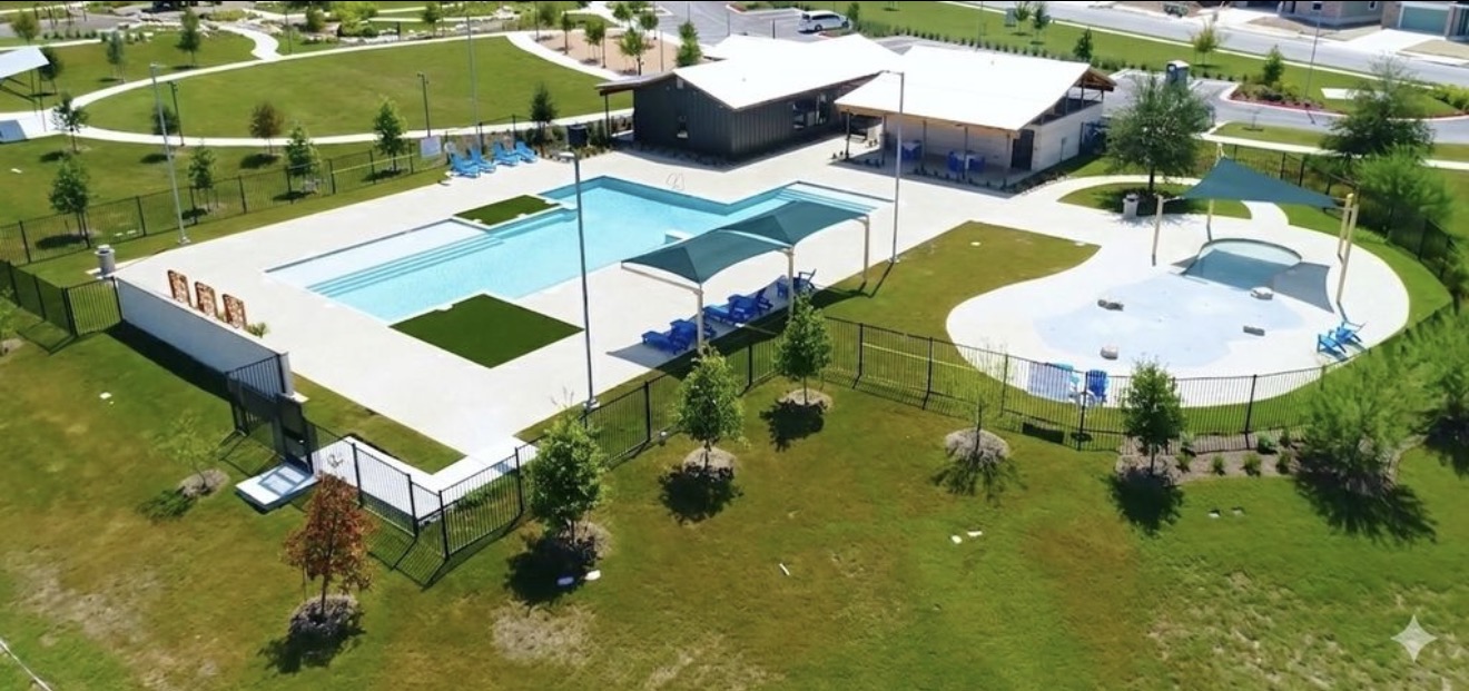 125 Madrid Kyle, TX 78640 - Photo 22 of 23 Drone / aerial view of a pool