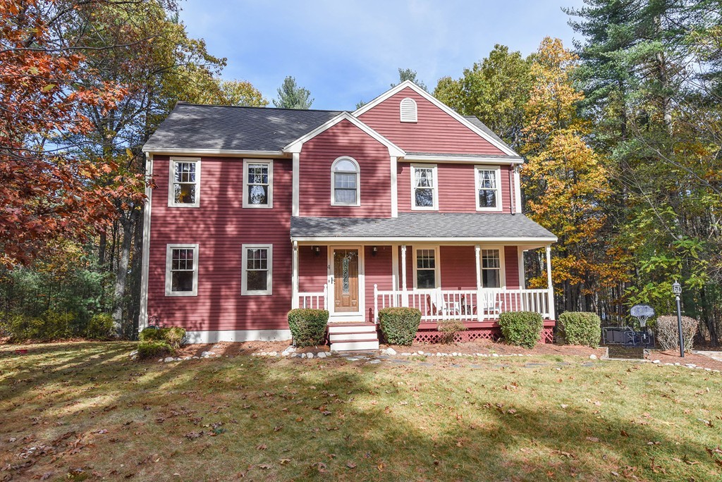 4 Nehemiah Road Shirley, MA 01464 - Photo 1 of 25 a front view of a house with yard and trees around