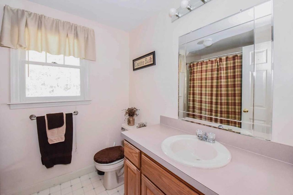 4 Nehemiah Road Shirley, MA 01464 - Photo 15 of 25 a bathroom with a granite countertop sink toilet and shower