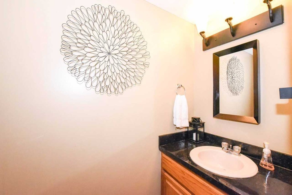 4 Nehemiah Road Shirley, MA 01464 - Photo 8 of 25 a bathroom with a sink and a mirror