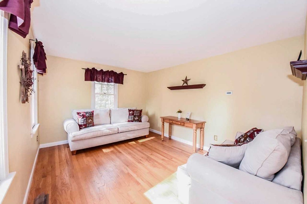 4 Nehemiah Road Shirley, MA 01464 - Photo 10 of 25 a living room with furniture and a wooden floor