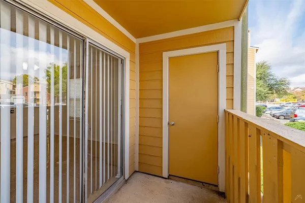a view of a porch with a door