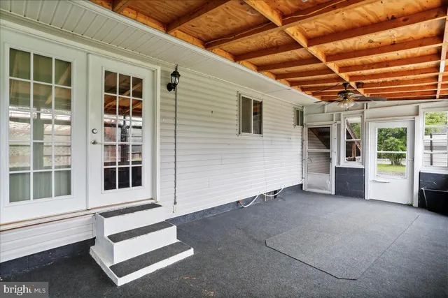 a view of an empty room with a balcony