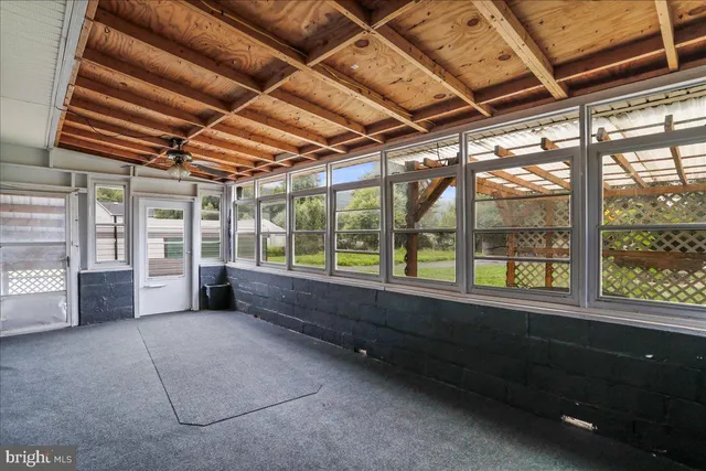 a view of empty room with wooden racks