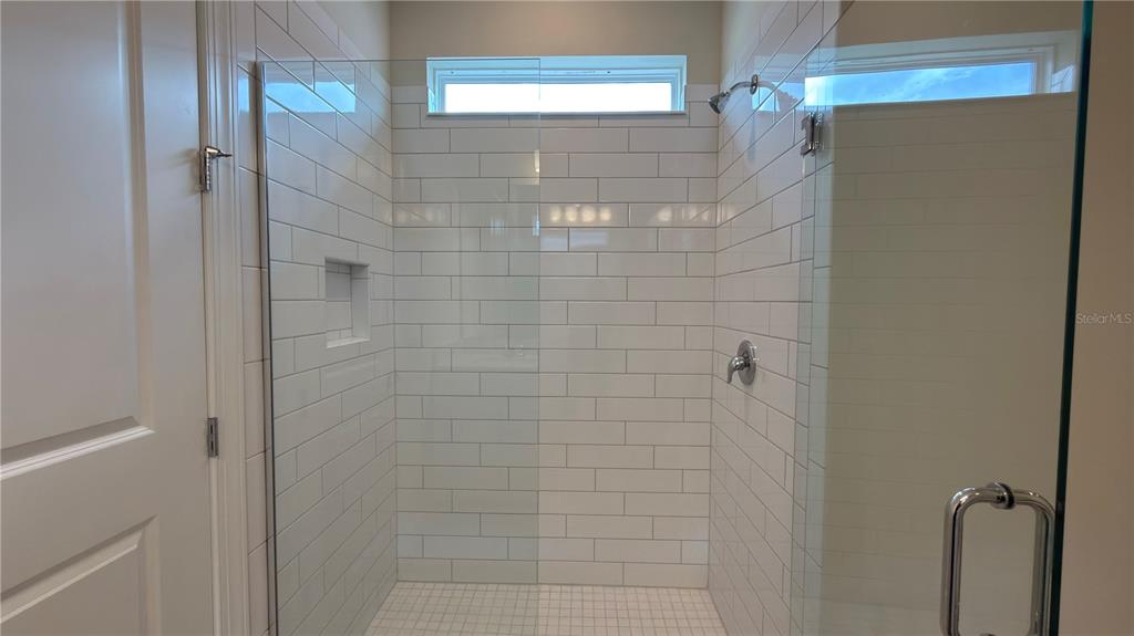 1523 Groveline Road St. Cloud, FL 34771 - Photo 19 of 30 a bathroom with a shower