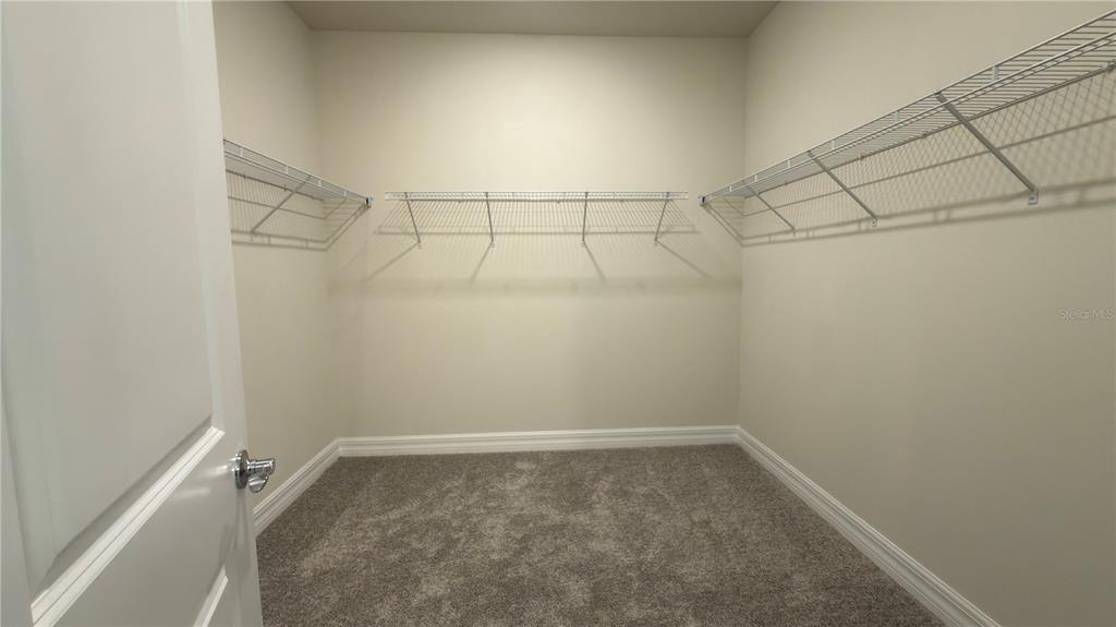 1523 Groveline Road St. Cloud, FL 34771 - Photo 21 of 30 a view of a room with racks on the wall