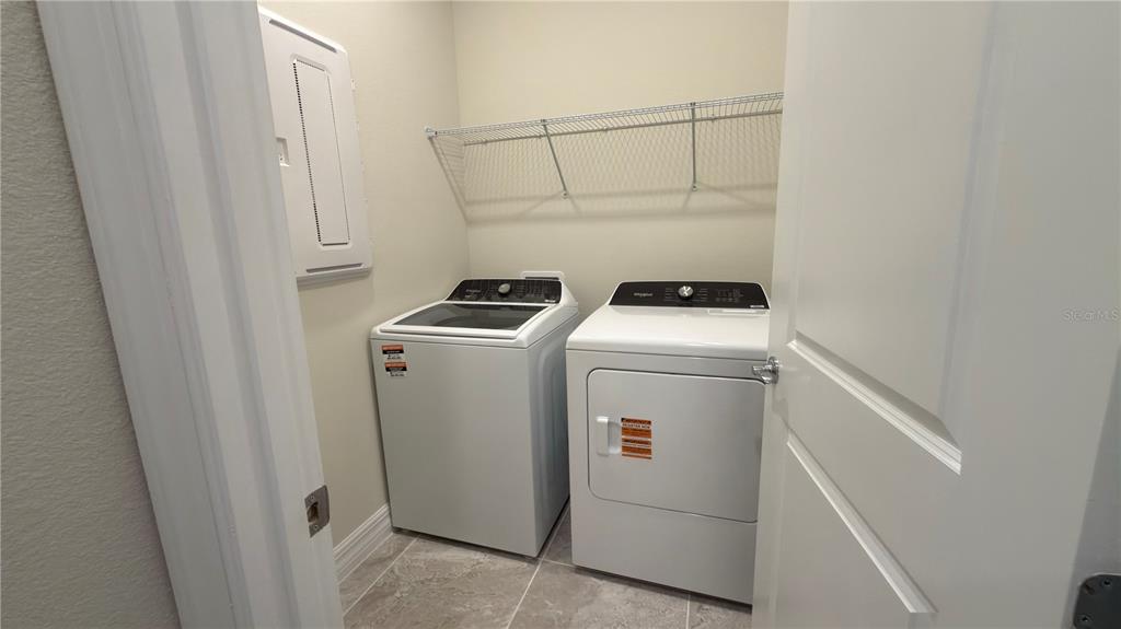 1523 Groveline Road St. Cloud, FL 34771 - Photo 29 of 30 a utility room with dryer and washer