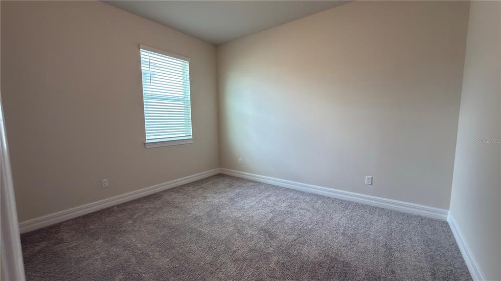 1523 Groveline Road St. Cloud, FL 34771 - Photo 8 of 30 an empty room with a window