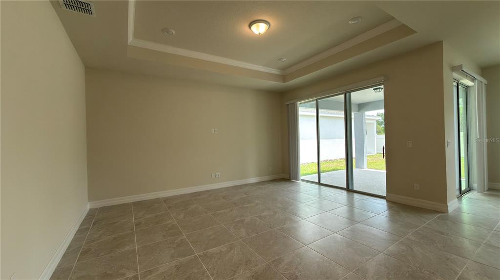 1523 Groveline Road St. Cloud, FL 34771 - Photo 10 of 30 an empty room with large windows and entrance