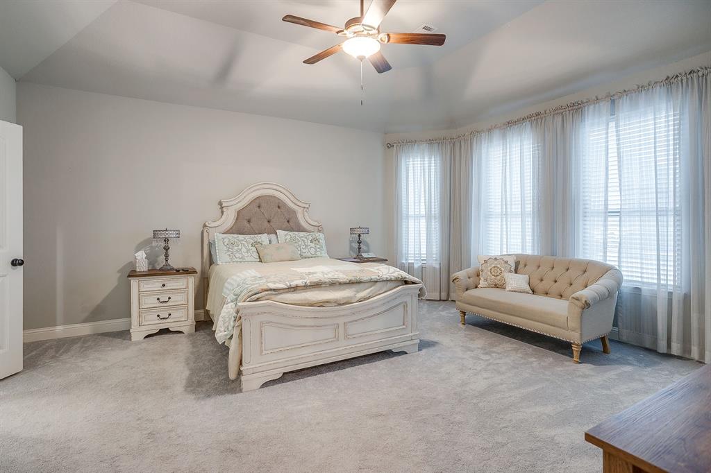 329 Madison Street Burleson, TX 76028 - Photo 17 of 40 a bedroom with furniture and white walls