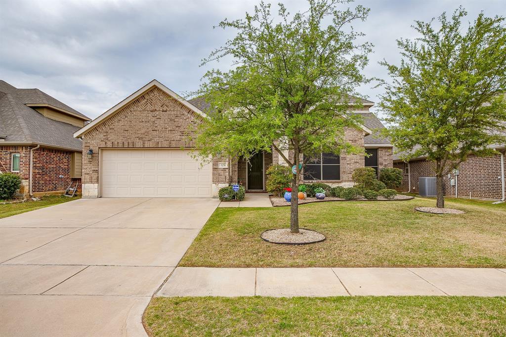 329 Madison Street Burleson, TX 76028 - Photo 2 of 40 a front view of a house with a yard