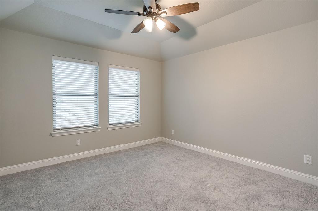 329 Madison Street Burleson, TX 76028 - Photo 25 of 40 an empty room with windows and fan