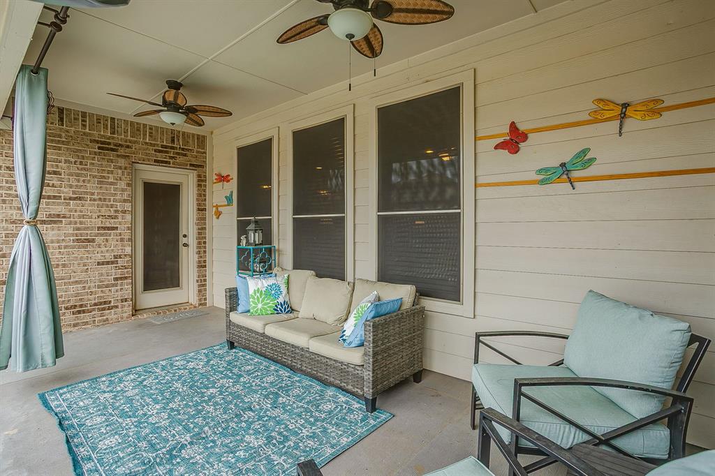 329 Madison Street Burleson, TX 76028 - Photo 34 of 40 a view of a patio with a table and chairs