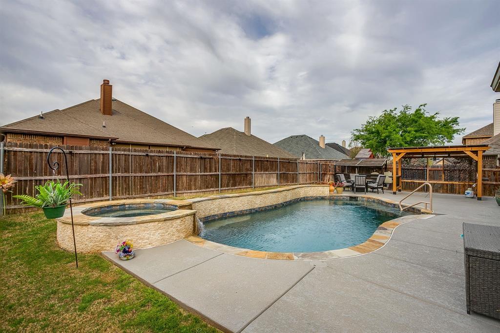 329 Madison Street Burleson, TX 76028 - Photo 39 of 40 a view of a house with swimming pool and sitting area