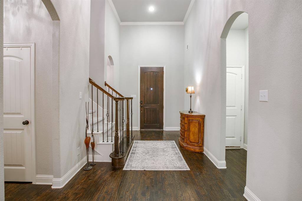 329 Madison Street Burleson, TX 76028 - Photo 5 of 40 a view of a hallway with wooden floor and staircase