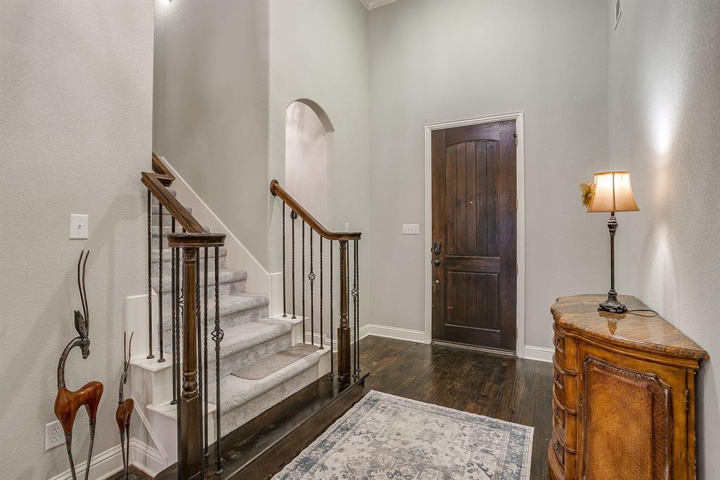 329 Madison Street Burleson, TX 76028 - Photo 6 of 40 a view of entryway with wooden floor and mirror
