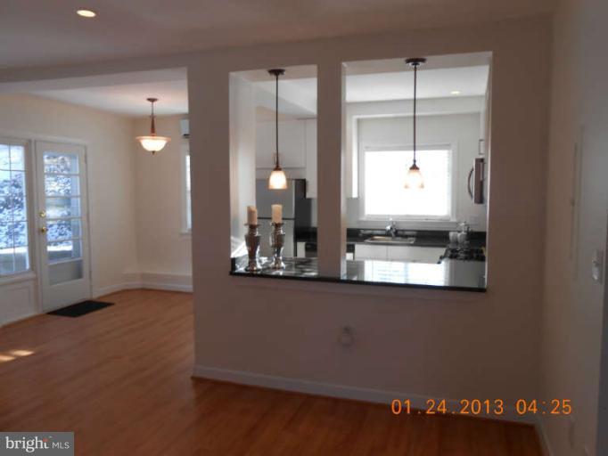 3203 Gunston Road, Unit 11032 Alexandria, VA 22302 - Photo 2 of 20 a view of a kitchen with a sink and cabinets