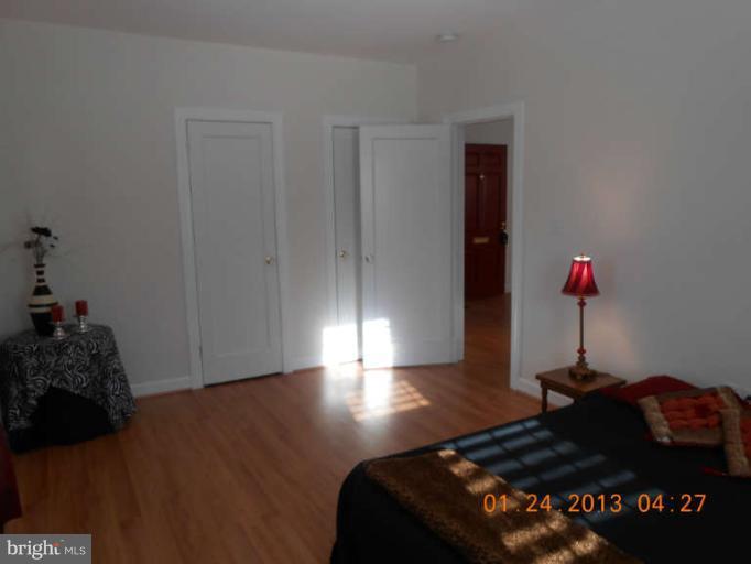 3203 Gunston Road, Unit 11032 Alexandria, VA 22302 - Photo 14 of 20 a bedroom with a bed window and dresser